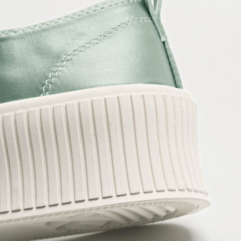 Close-up of Women's Casual Lace Up Sports Shoe SF1008 with thick white rubber sole and silk upper in mint color.